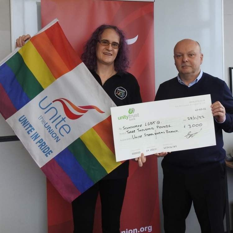 Emily accepting the cheque from Unite The Union