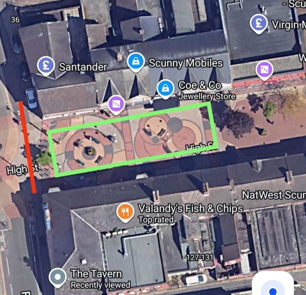 Aerial view of a street map highlighting High Street and surrounding shops including Santander bank and a fish and chips restaurant.